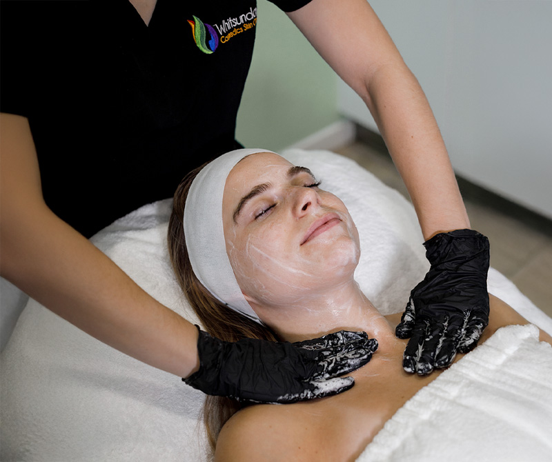 Client lying on treatment bed having a skin rejuvenation facial